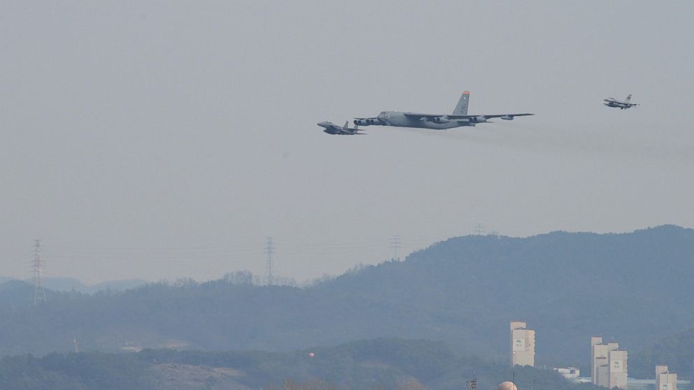 A United States Air Force B-52 Stratofortress from Andersen Air Base Guam, conducted a low-level flight in the vicinity of Osan, South Korea, in response to recent provocative action by North Korea Jan 10, 2015. The B-52 was joined by a ROK F-15K Slam Eagle and a U.S. F-16 Fighting Falcon.