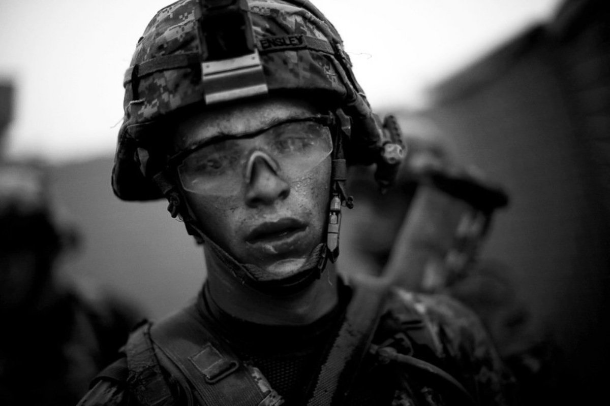 PHOTOBravo Company's Pvt. Cody Lee Ensley walks through the safety of the gates at an American base after a daylong fierce attack by insurgents near Payendi. From the NPR story "Signs Of Traction In U.S. Fight Against Afghan Taliban," published in 2010.