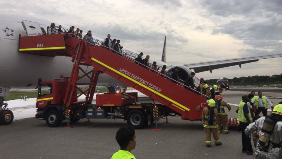 PHOTO: A Singapore Airlines plane caught fire while making an emergency landing at Singapore’s Changi Airport, June, 27, 2016.