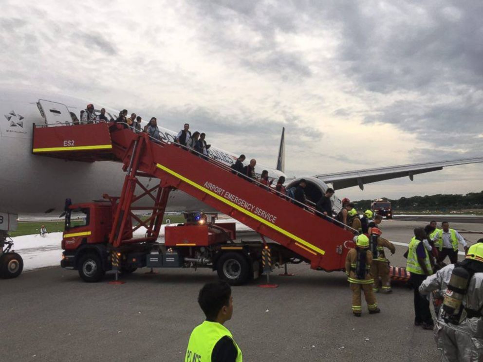 PHOTO: A Singapore Airlines plane caught fire while making an emergency landing at Singapore’s Changi Airport, June, 27, 2016.