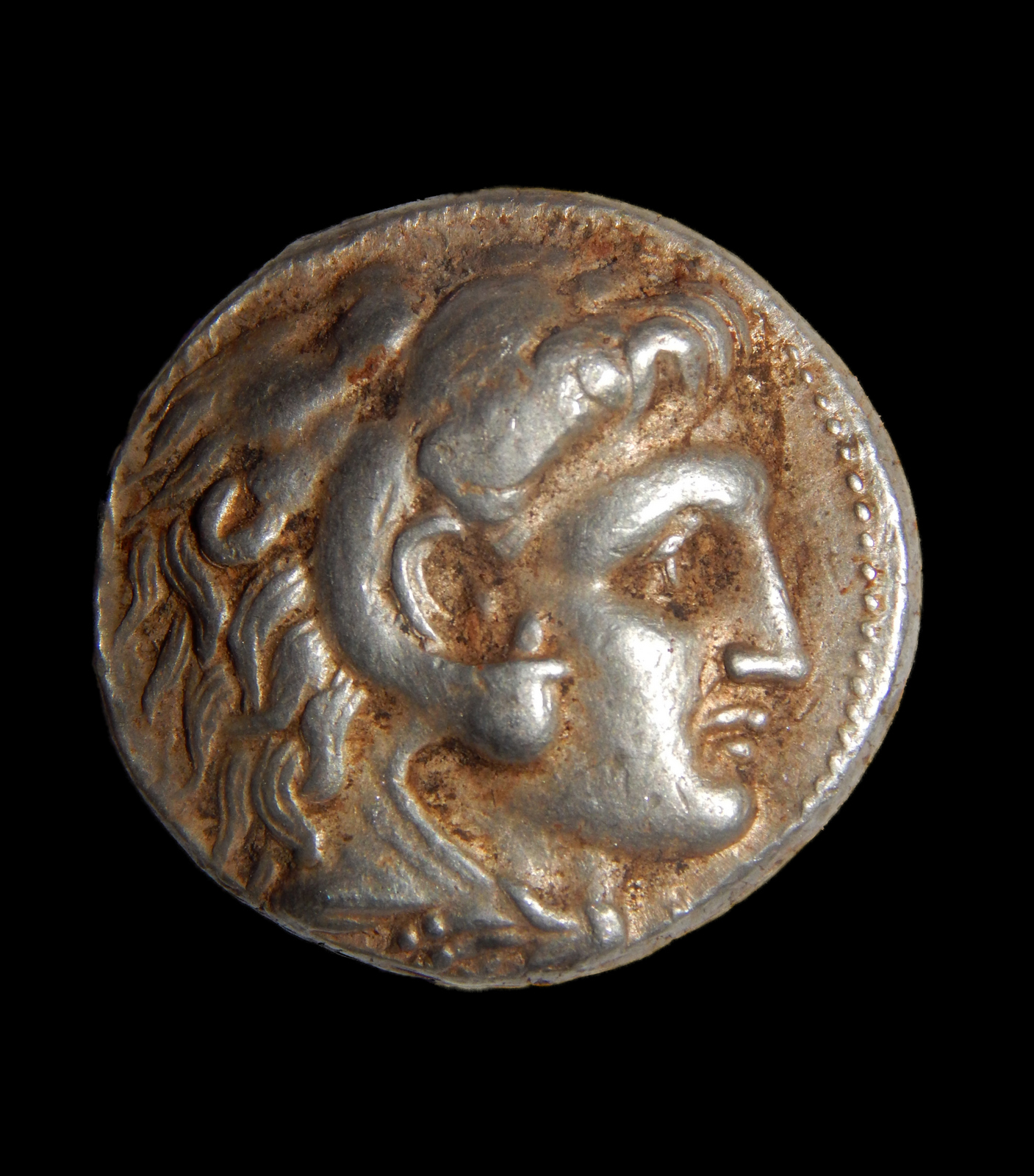 PHOTO: A coin of Alexander of Macedon was among a cache of silver objects discovered in a cave in northern Israel.