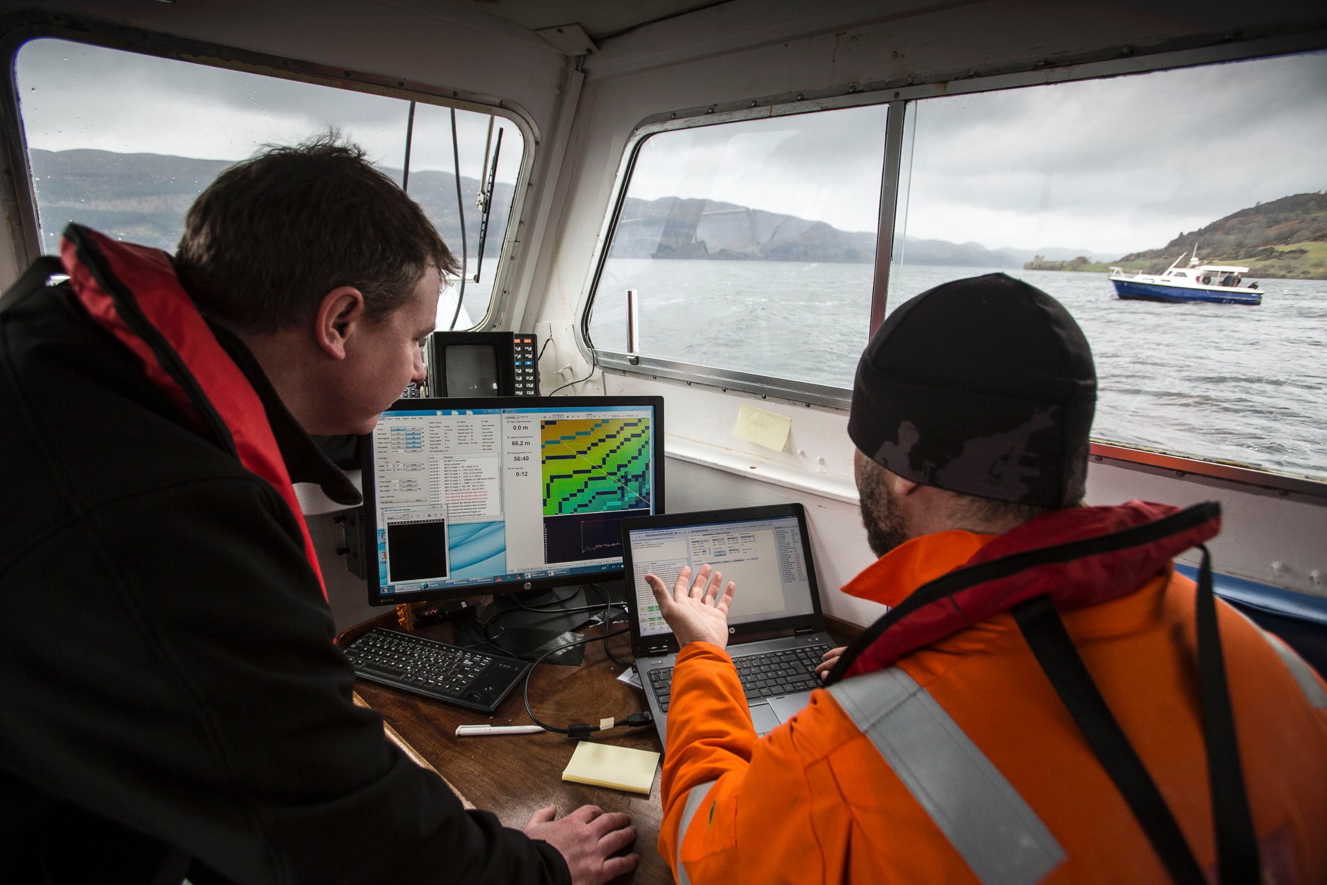 PHOTO: Scientists and experts with The Loch Ness Project working on underwater surveying.