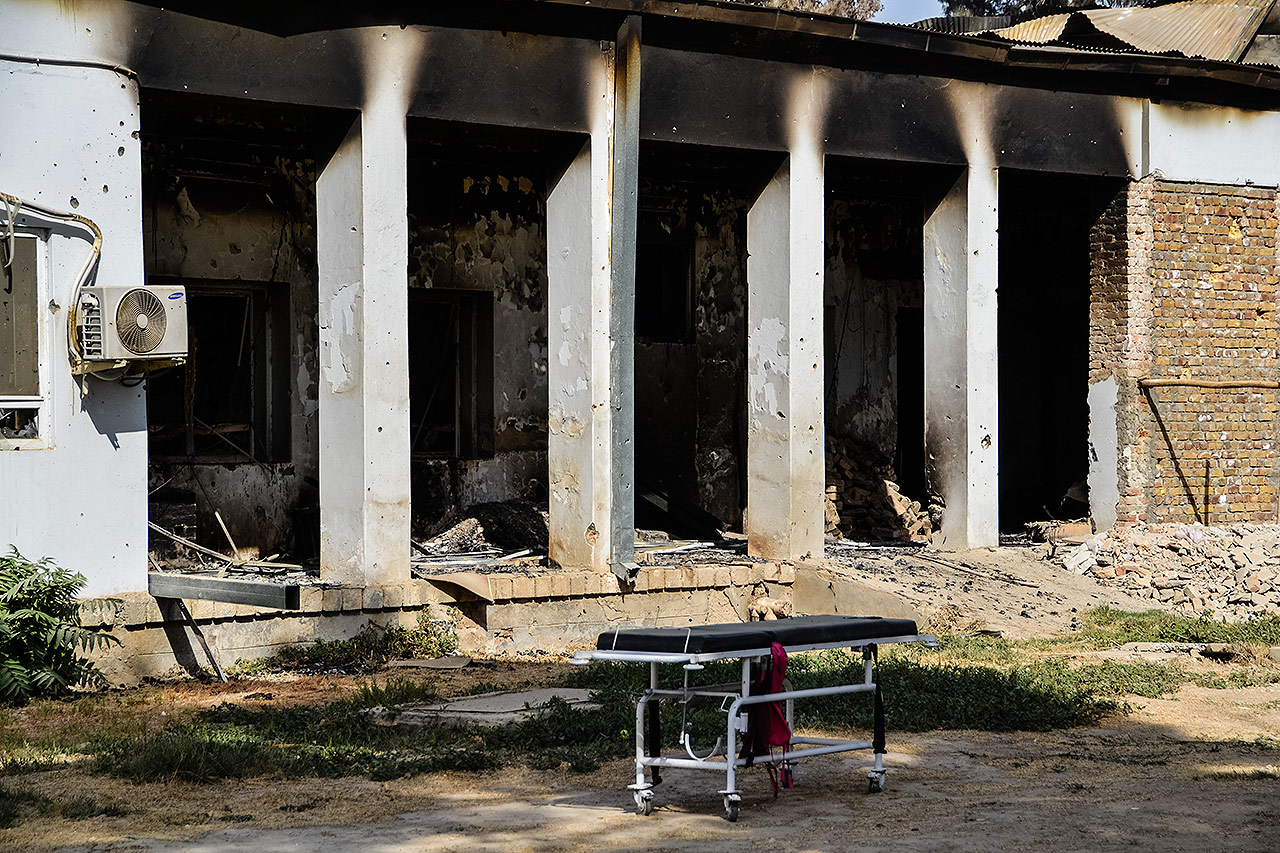 PHOTO:An emergency trolley bed lies abandoned in front of the heavily damaged entrance of the physiotherapy department. The hospital was hit by U.S. airstrikes on October 3, 2015.  