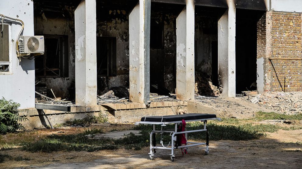 PHOTO:An emergency trolley bed lies abandoned in front of the heavily damaged entrance of the physiotherapy department. The hospital was hit by U.S. airstrikes on October 3, 2015.  