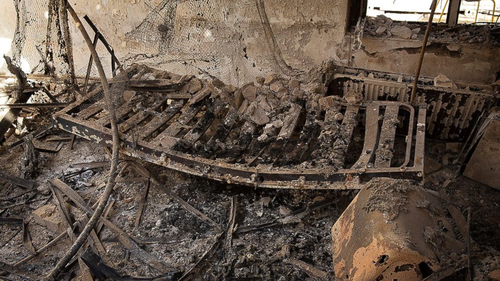 PHOTO: A charred and twisted bed-frame lies among ashes in a burnt room inside the MSF hospital in Kunduz hit by U.S. airstrikes on October 3, 2015.