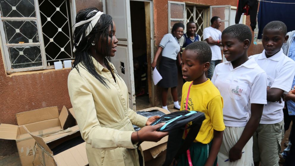 PHOTO: Actress Lupita Nyong'o delivering backpacks to children in Katwe, Uganda at the SOM Chess Academy, July 13, 2016.