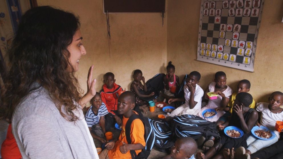 PHOTO: Salima Visram conducting surveys with local children to understand the impact of these backpacks. Katwe, Uganda. 