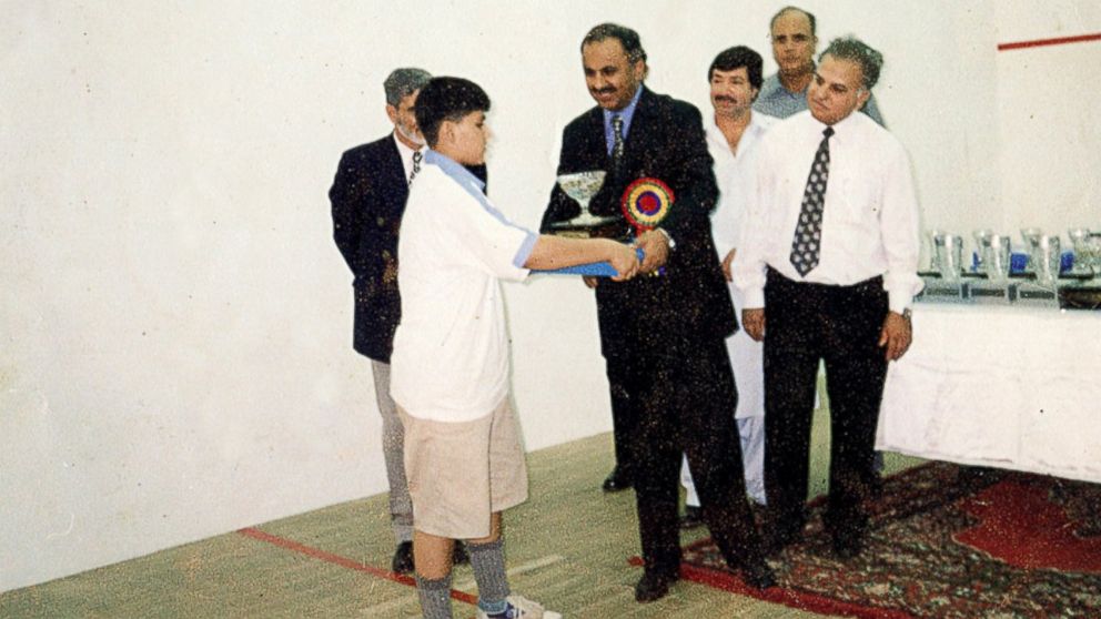 PHOTO:  Maria Toorpakia became the best female squash player in Pakistan after years of playing as a boy. Here is she seen receiving her first squash trophy.  First place, Under 13 Hashim Khan Junior Squash Champtionship. 