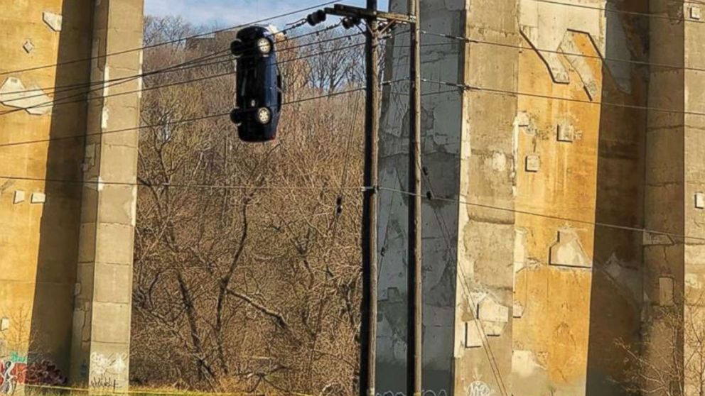 Toronto police investigating prank that left car dangling from bridge ...