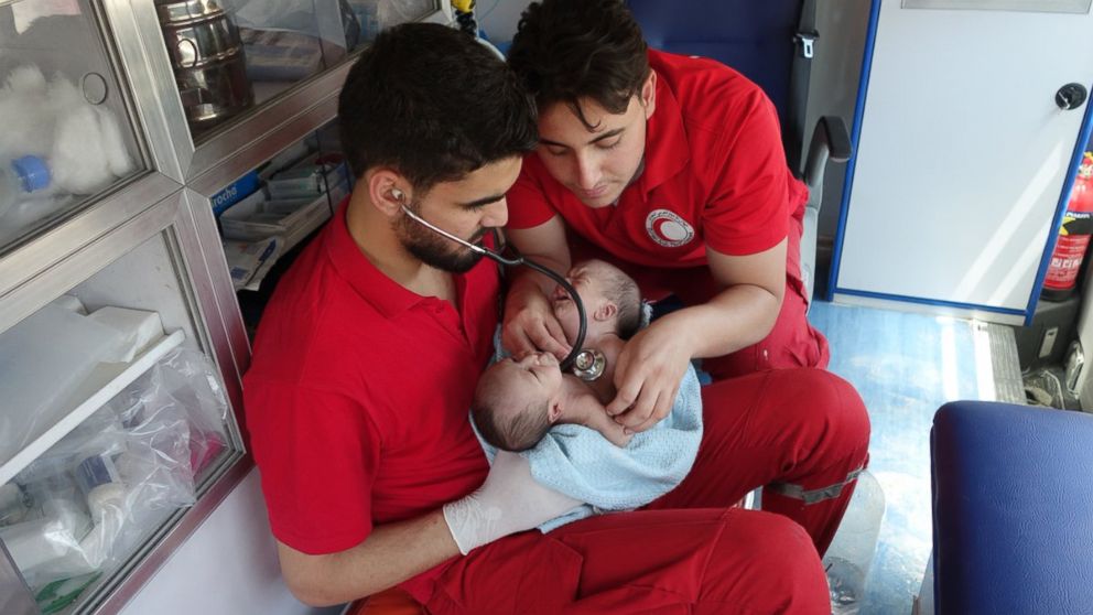 The Syrian Red Crescent moved conjoined twins Nawras and Moaz from Ghouta to a hospital in Damascus.
