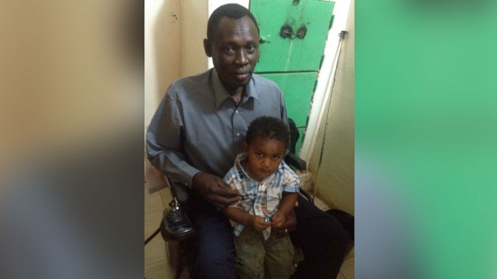 PHOTO: Daniel Wani, with son Martin, after a visit to see his wife, Meriam Ibrahim, in Sudan, May 29, 2014.