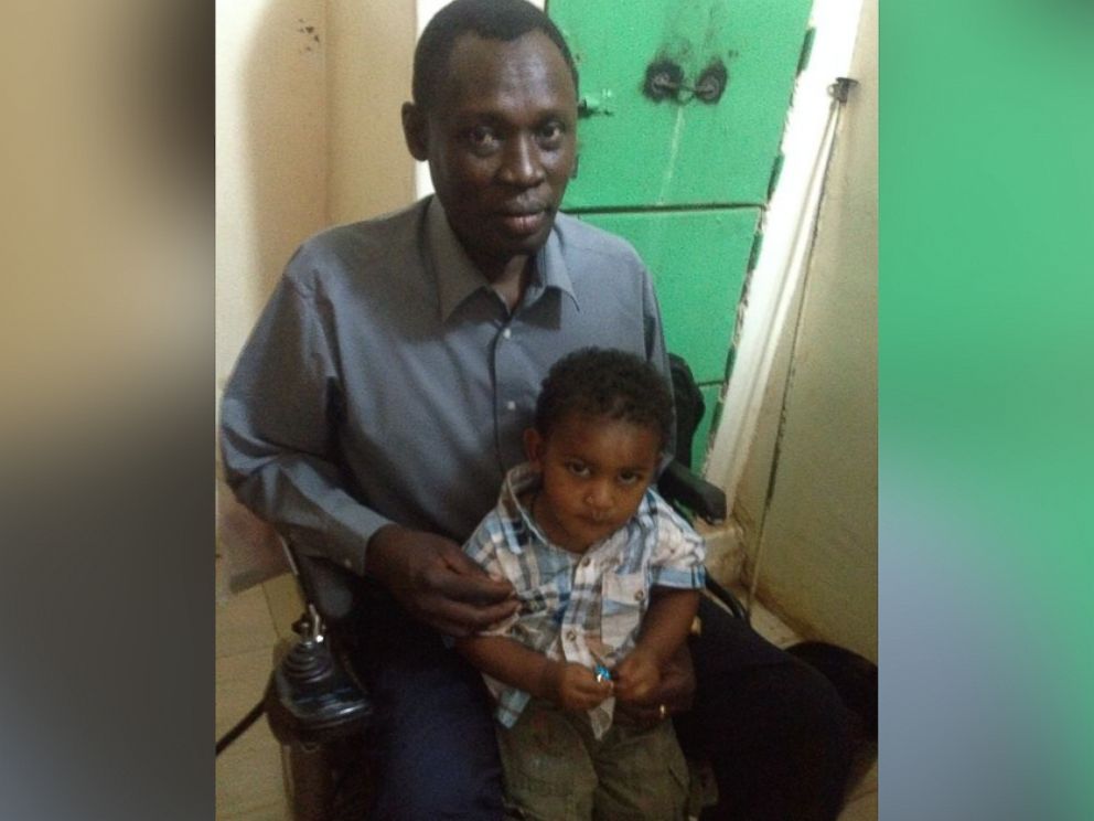 PHOTO: Daniel Wani, with son Martin, after a visit to see his wife, Meriam Ibrahim, in Sudan, May 29, 2014.