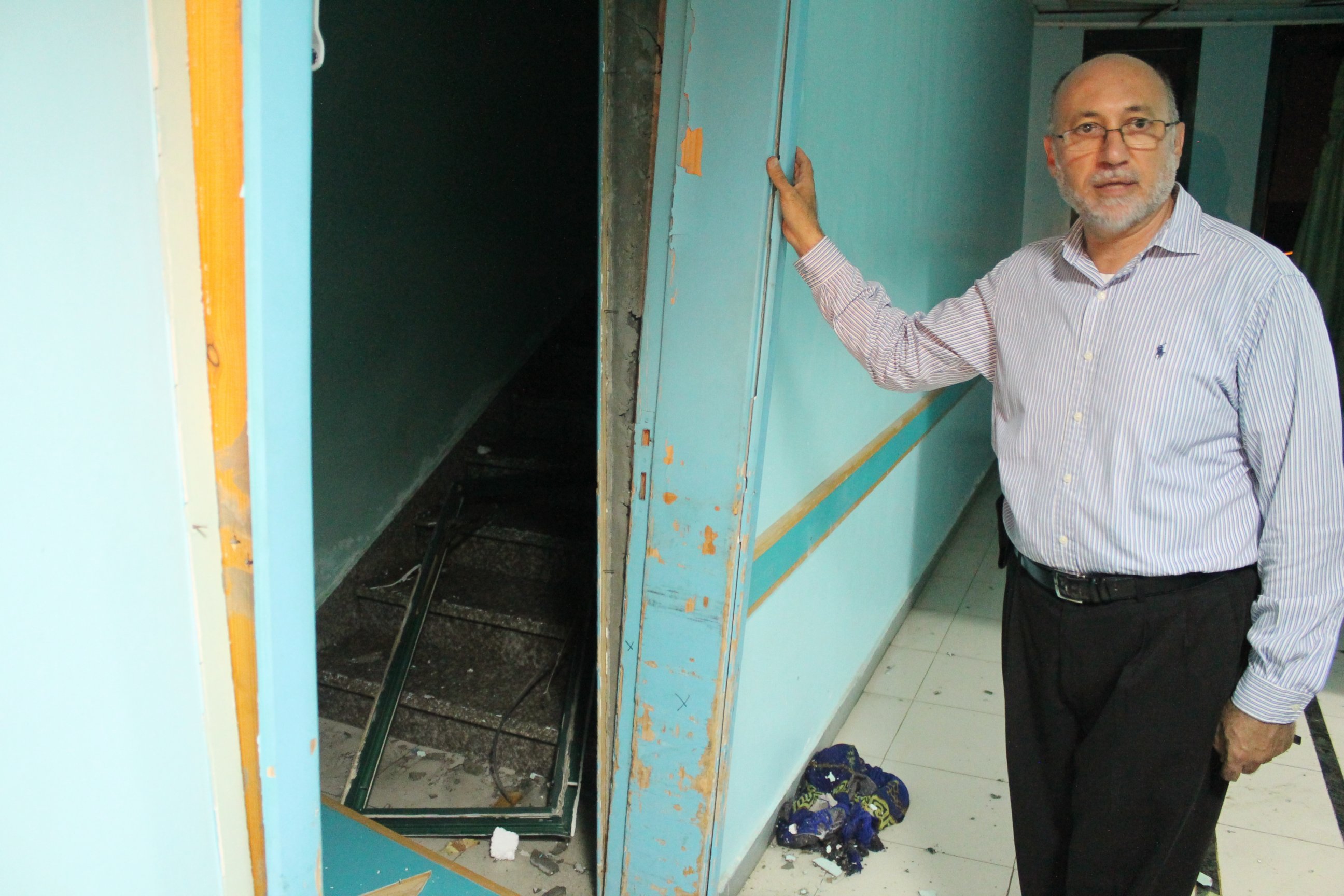 PHOTO: Basman Alashi, executive director of El-Wafa Hospital in eastern Gaza City, shows the damage caused by an Israeli projectile that struck the hospital's fourth floor Friday evening, demolishing a wall and damaging doors and windows. 