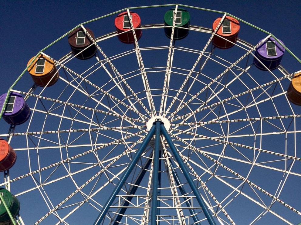PHOTO: Visitors enjoys rides at City Park, a new amusement park in Kabul.