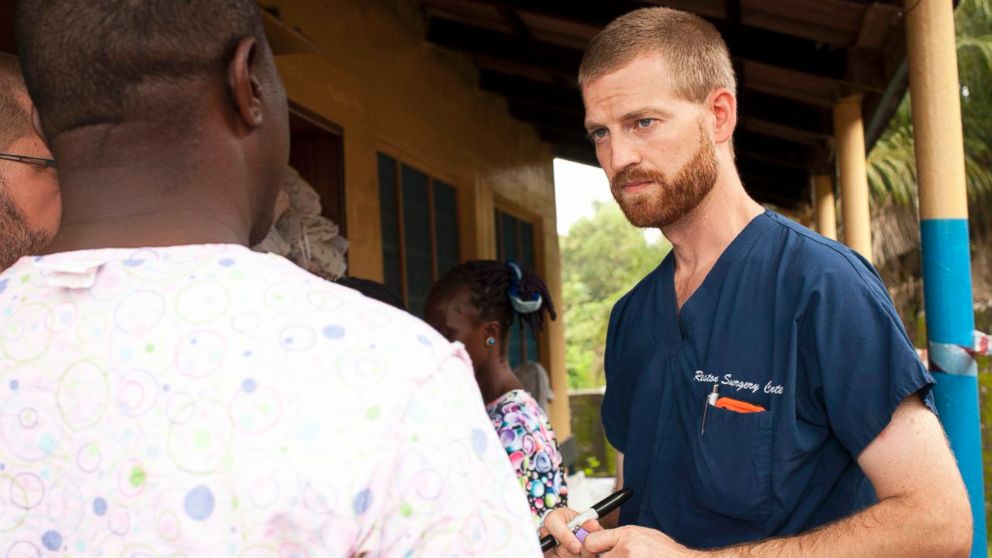 Dr. Kent Brantly speaks with a worker outside the ELWA Hospital in Monrovia, Liberia, in this undated handout photo provided by Samaritan's Purse.