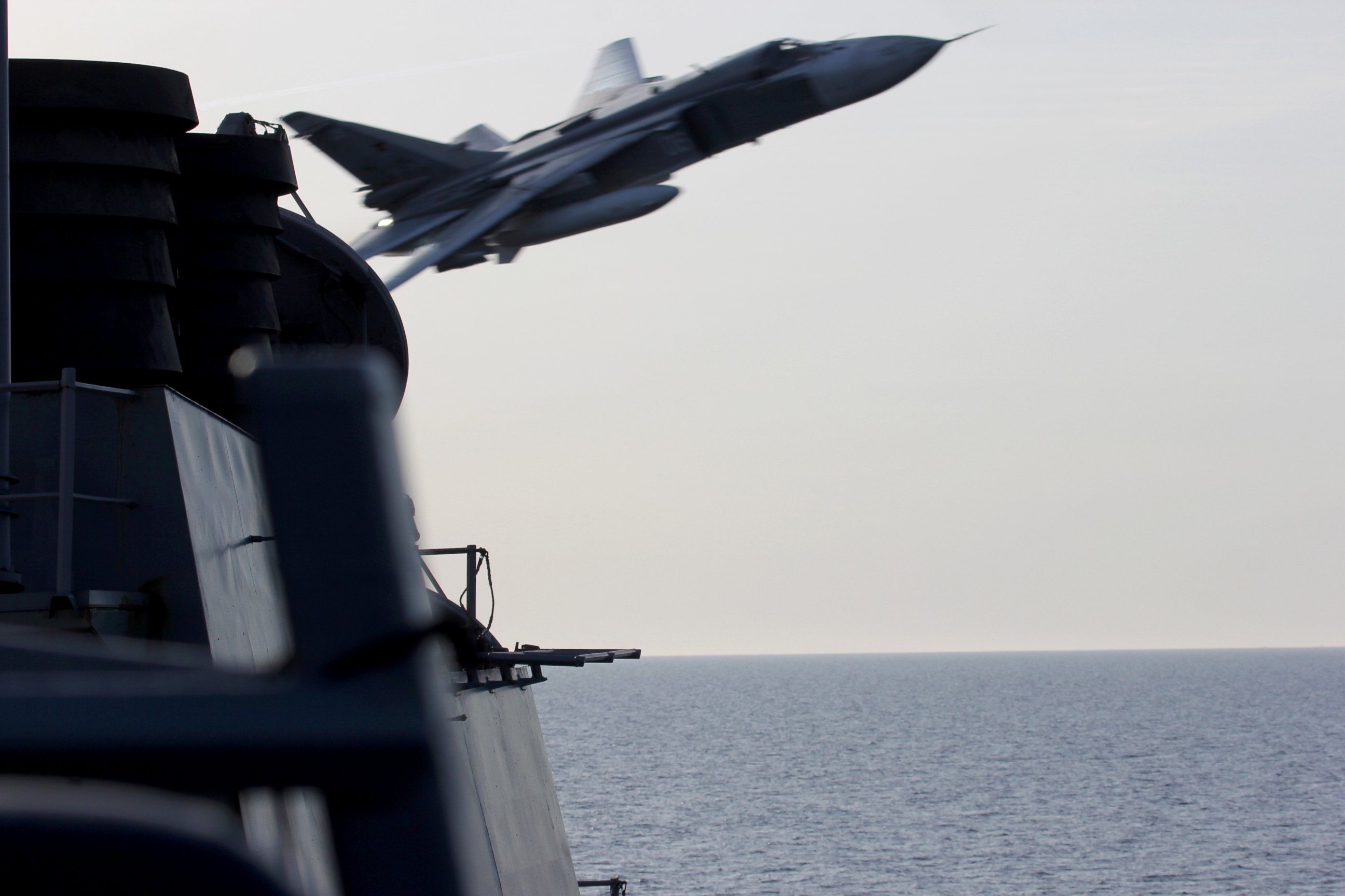 PHOTO: The US European Command released this photo of a Russian SU-24 fighter jet's close pass over the USS Donald Cook earlier this week in the Baltic Sea. 