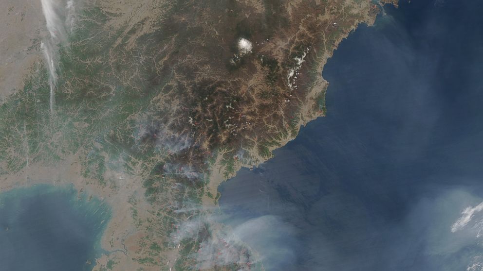 NASA has released satellite images of North Korea, taken on April 25, 2014, showing large fires burning in wooded areas all across the country.