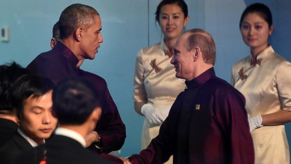 PHOTO: The Kremlin released a photo of President Putin smiling as President Obama greeted him before the APEC class photo, Nov. 10, 2014, in Beijing.