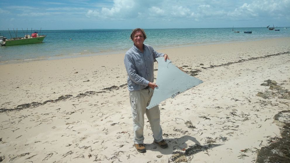 PHOTO: Blaine Alan Gibson holds debris he found on a beach in Mozambique. Officials are investigating if it is from the missing Malaysian Airline flight 370. 