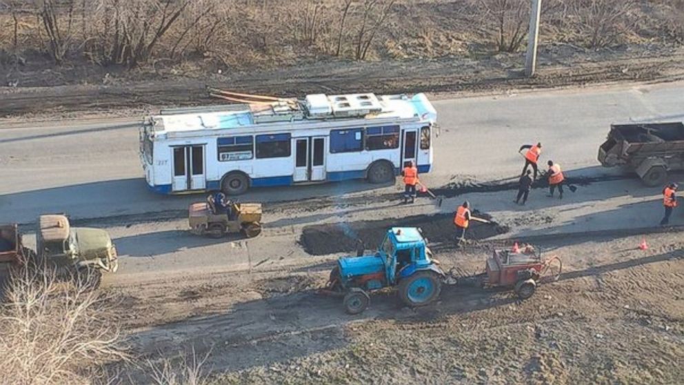 PHOTO: Workers resurface roads in Omsk, Russia, a day after a local woman complained to Russian President Vladimir Putin that they were in a terrible condition and authorities were doing nothing. 