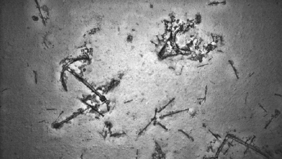 PHOTO: An anchor is seen among debris from a shipwreck found in May in the search for MH370.