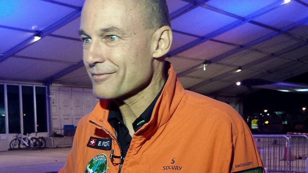 PHOTO: Solar Impulse co-founder and pilot Bertrand Piccard speaks to reporters at an airport