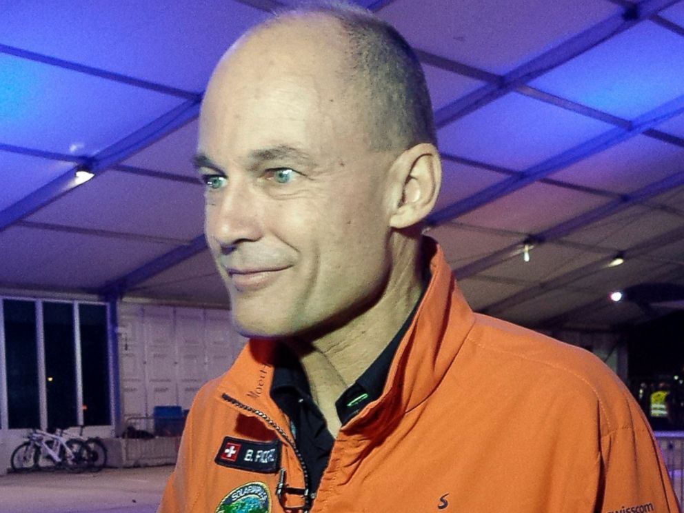 PHOTO: Solar Impulse co-founder and pilot Bertrand Piccard speaks to reporters at an airport