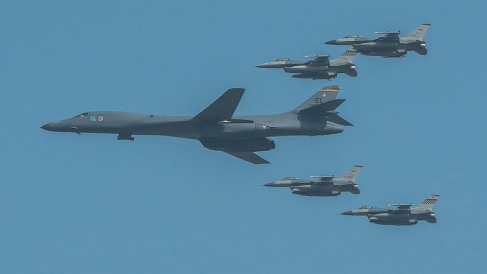 PHOTO: A U.S. Air Force B-1B Lancer, escorted by U.S. Air Force F-16 Fighting Falcons, performs a flyover over Osan Air Base, in South Korea, Sept. 13, 2016. 