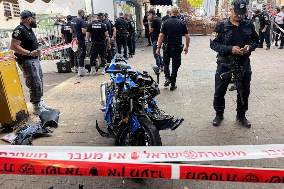 PHOTO: Israeli police stand around a motorbike following a stabbing attack in Hadera, Israel on Oct. 9, 2024.
