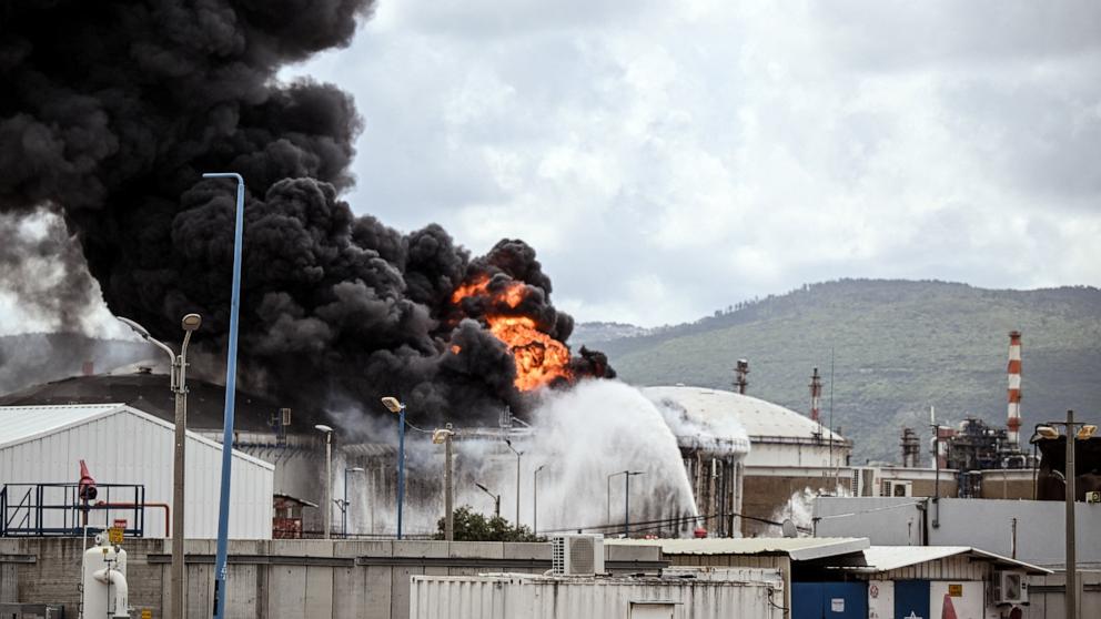 PHOTO: A fire burns after Israel's Fire and Rescue Service said that an industrial building and a fuel tanker at Israel's Oil Refineries were hit by debris from an intercepted Iranian missile in Haifa, Israel, on March 30, 2026.
