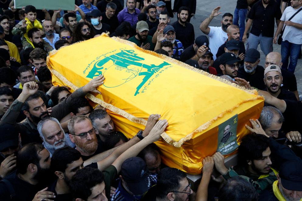 PHOTO: Mourners carry the flag-draped coffin of a Hezbollah fighter killed by an Israeli strike in Beirut, Lebanon on Sept. 27, 2024.