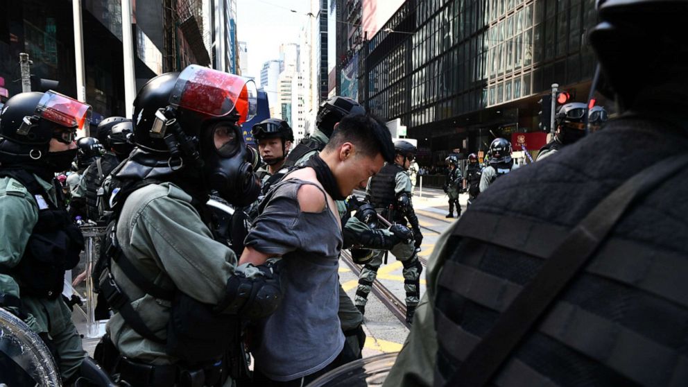 Hong Kong protester shot by police while a pro-China man is set on fire, over 260 arrested - ABC News