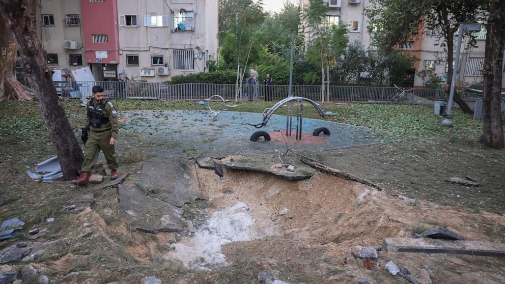 PHOTO: An Israeli soldier observes the site where the missile launched from Yemen landed in Tel Aviv, Israel, on Dec. 21, 2024.