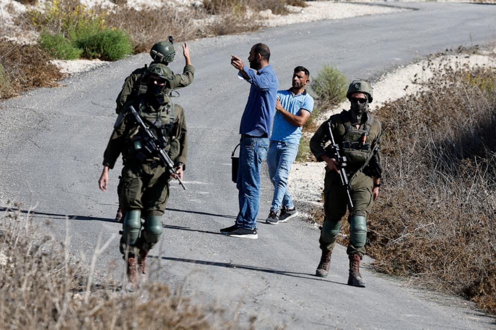 PHOTO: This file photo shows Israeli forces hindering access of Palestinians and foreign activists to olive trees during olive harvest, in the village of Tell, near Nablus, in the Israeli-occupied West Bank, on Oct. 20, 2025.