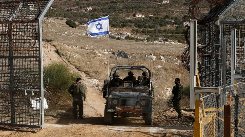 PHOTO: Israeli military vehicles return from the buffer zone with Syria near the Druze village of Majdal Shams in the Israel-occupied Golan Heights, on Dec. 10, 2024.