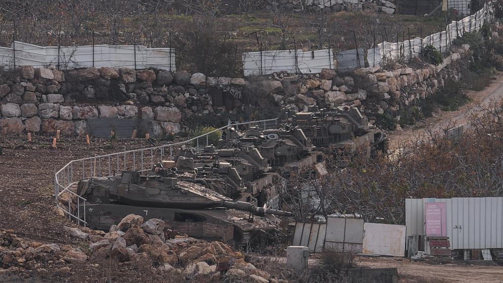 PHOTO: Israeli armored vehicles park near the so-called Alpha Line that separates the Israeli-occupied Golan Heights from Syria on Dec. 8, 2024.