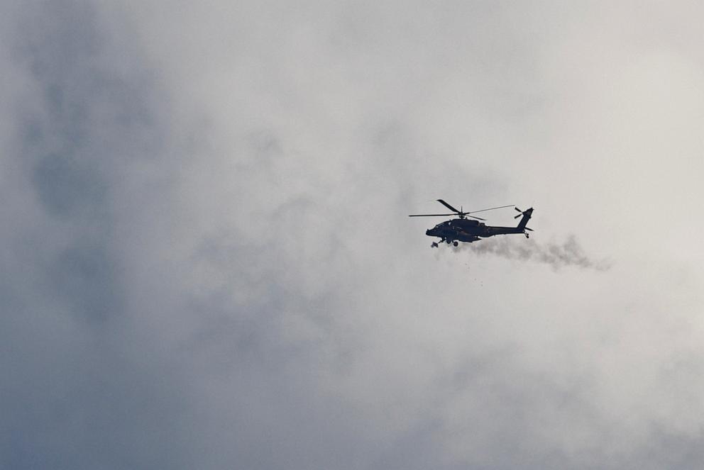 PHOTO: An Israeli Apache helicopter fires as it flies over Gaza, as seen from the Israeli side of the border with Gaza, on Sept. 25, 2025.