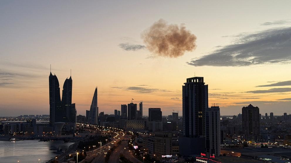 PHOTO: Smoke rises after an Iranian drone was intercepted over the Bahrain Financial Harbour towers, which houses the Israeli embassy, in Manama