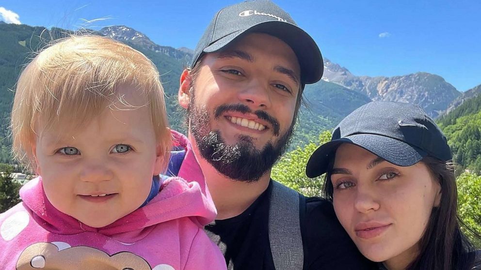 PHOTO: Igor Makushinksy holds his daughter with his wife for a photo in the mountains of Bardonecchia, in the Piedmont region of Italy, in June 2022.