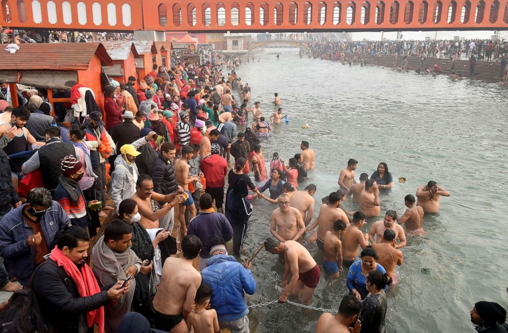 PHOTO: Hindu devotees take a holy dip in the waters of river Ganges to mark "Makar Sankranti" festival, which falls on the first day of the religious Kumbh Mela, or "festival of the pot."