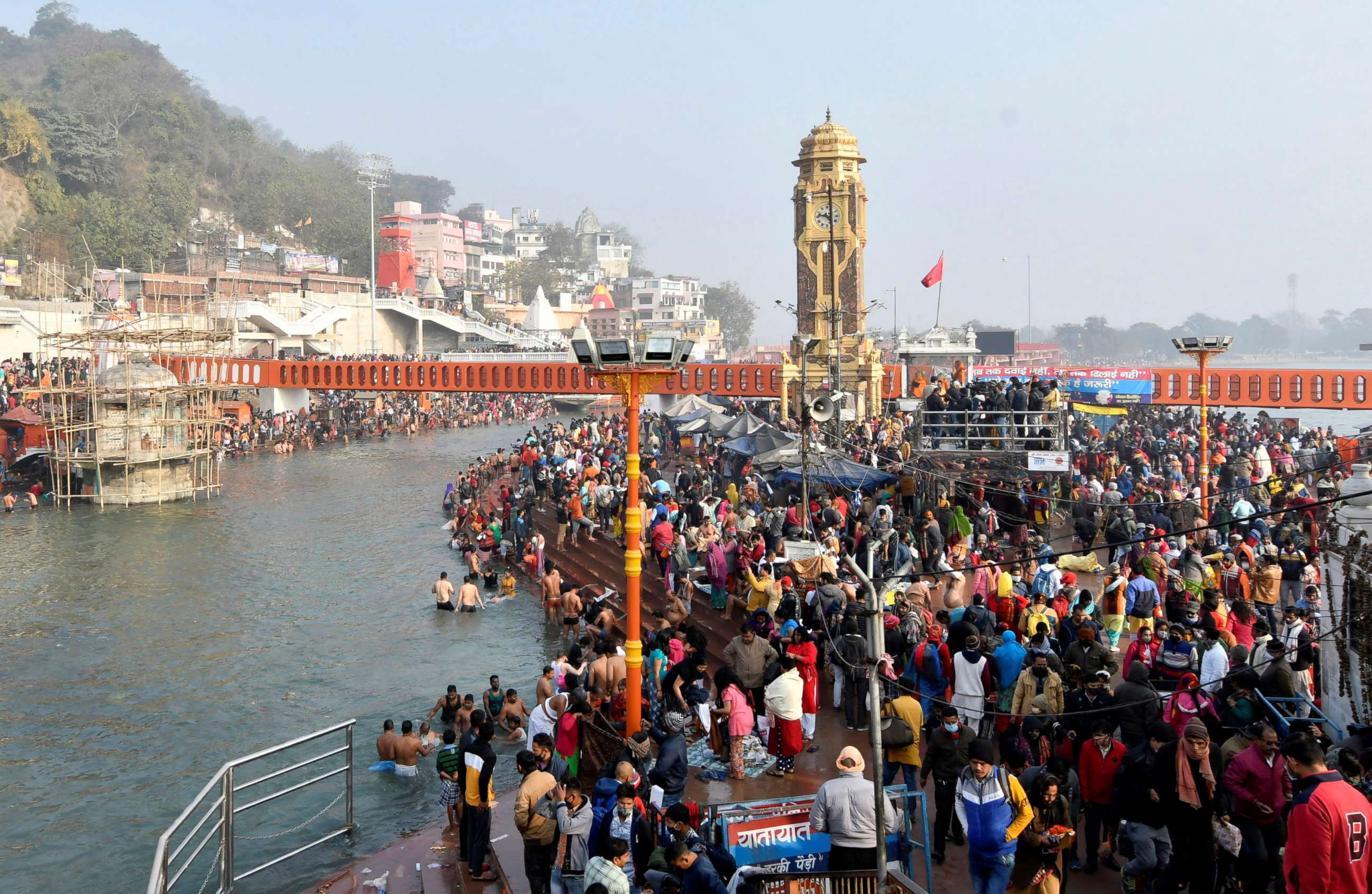 PHOTO: Hindu devotees gather to take a holy dip in the waters of river Ganges to mark "Makar Sankranti" festival, which falls on the first day of the religious Kumbh Mela, or "festival of the pot." 