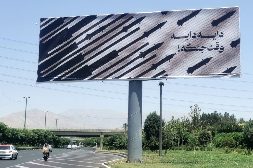 PHOTO: Commuters drive past an anti-Israel billboard in Tehran, Iran, on June 22, 2025.