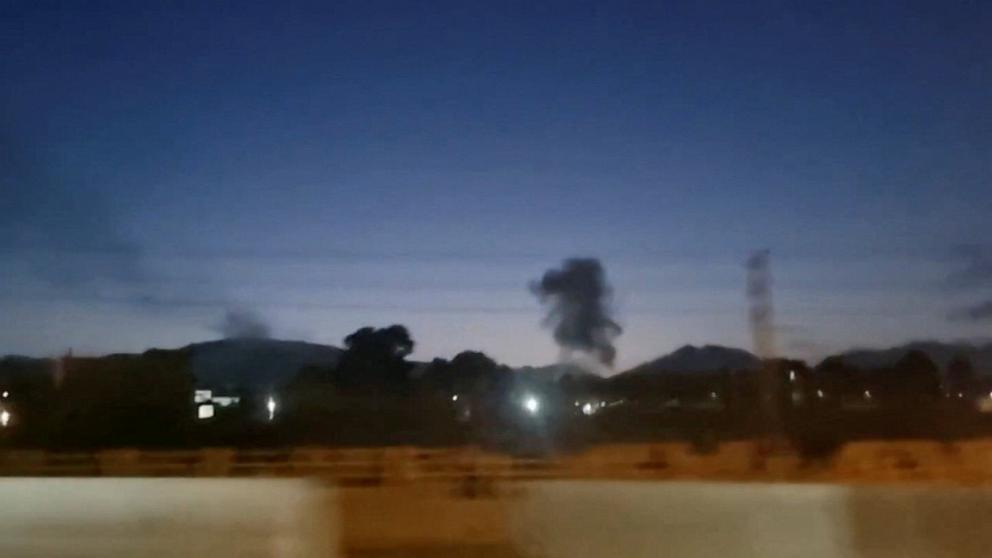 PHOTO: A plume of smoke rises in Karaj, Iran, in this screen grab obtained from social media video released June 11, 2026, after Iranian news agencies reported explosions in several cities across the country.