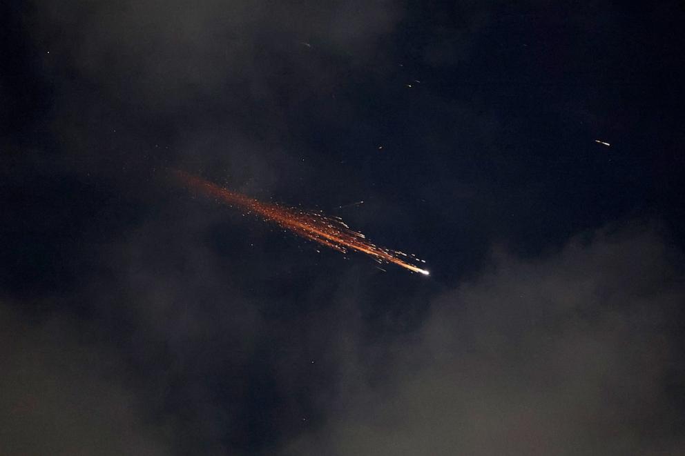 PHOTO: Rocket trails are seen in the sky above the Israeli coastal city of Netanya amid a fresh barrage of Iranian missile attacks on June 21, 2025.