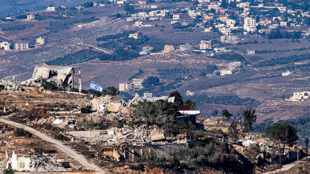 PHOTO: An Israeli flag is seen over the Lebanese village of Adaisseh after a ceasefire between Israel and Hezbollah, as seen from Israel's border with Lebanon on Dec. 1, 2024.