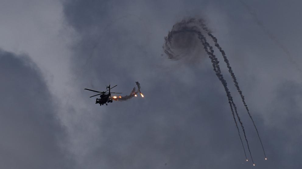 PHOTO: An Israeli Apache helicopter releases flares near the Israeli-Lebanon border, as seen from northern Israel, on Oct. 2, 2024.