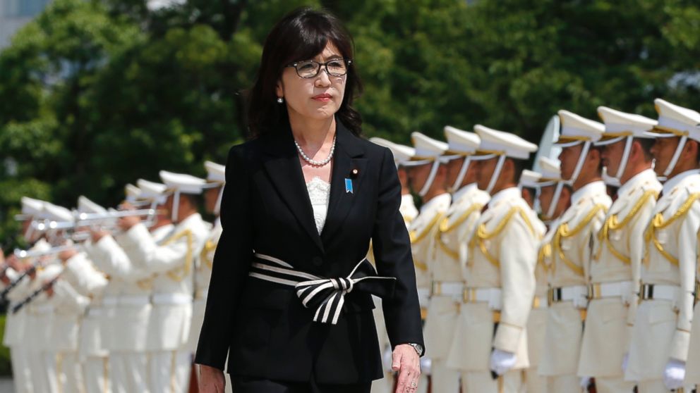 Japan's new Defense Minister, Tomomi Inada, inspects a honor guard on her first day at the Defense Ministry in Tokyo, Aug. 4, 2016. 