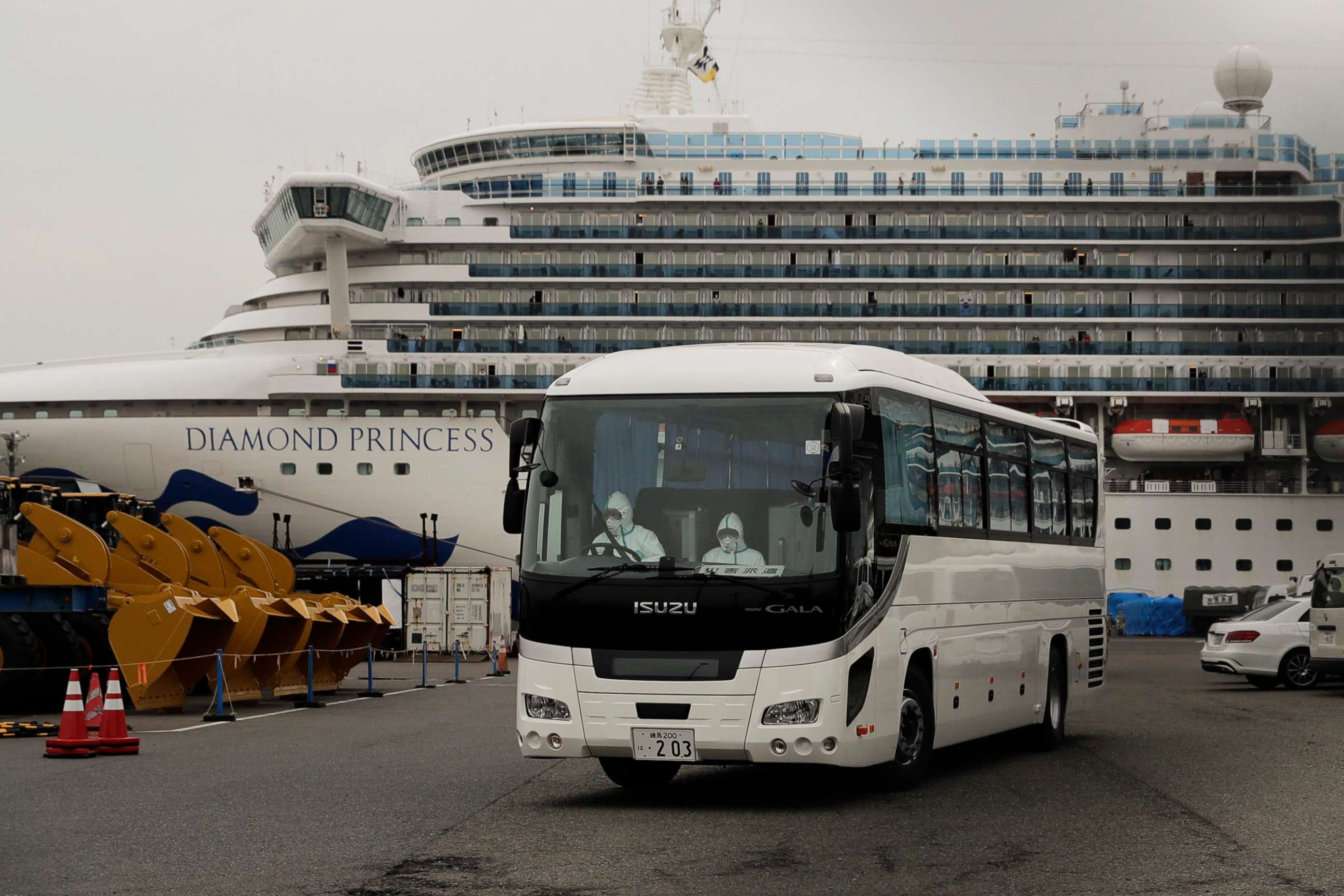 PHOTO: A bus leaves a port where the quarantined Diamond Princess cruise ship is docked Saturday, Feb. 15, 2020, in Yokohama, near Tokyo. 