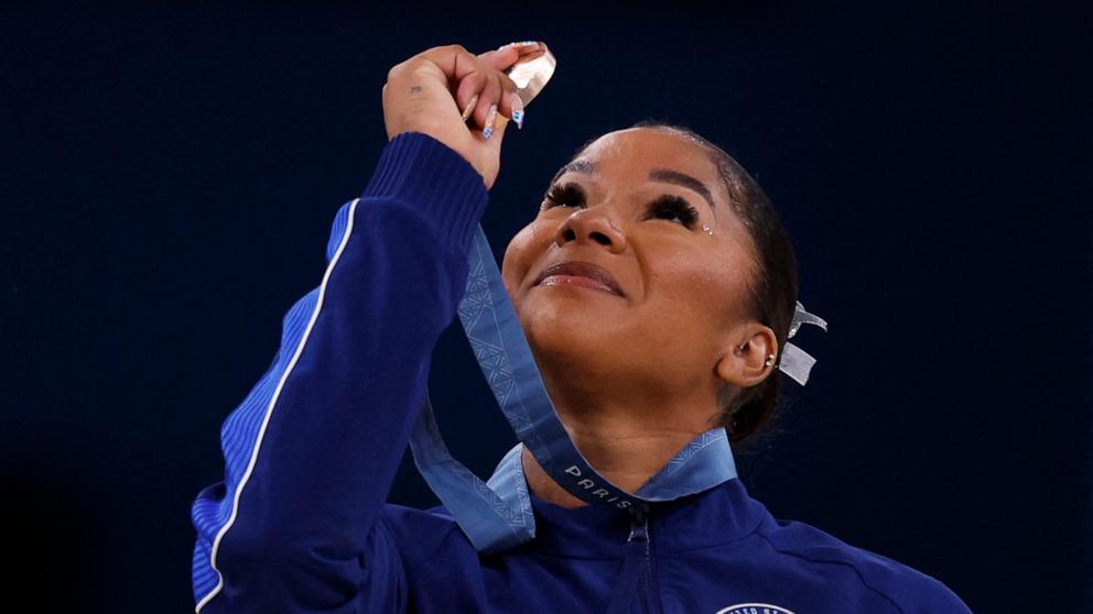 PHOTO: Bronze medallist Jordan Chiles of United States looks at her medal at the 2024 Paris Olympics in Bercy Arena in Paris, France, Aug. 5, 2024. 