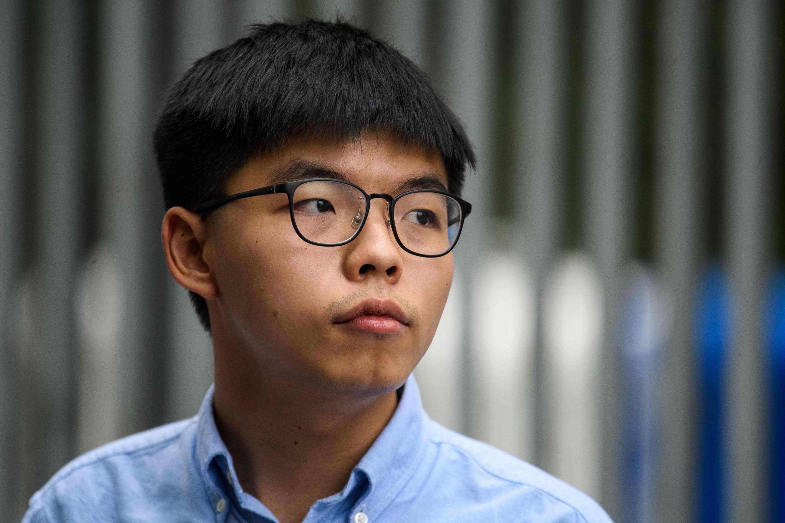 PHOTO: This file photo taken on October 29, 2019 shows pro-democracy activist Joshua Wong speaking to the media outside the Legislative Council (LegCo) in Hong Kong, after he was barred from standing in an upcoming local election.